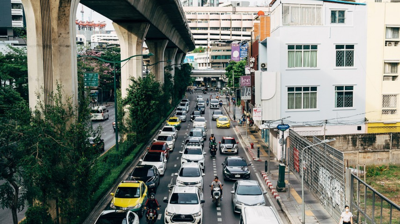 Cars in traffic in a city centre